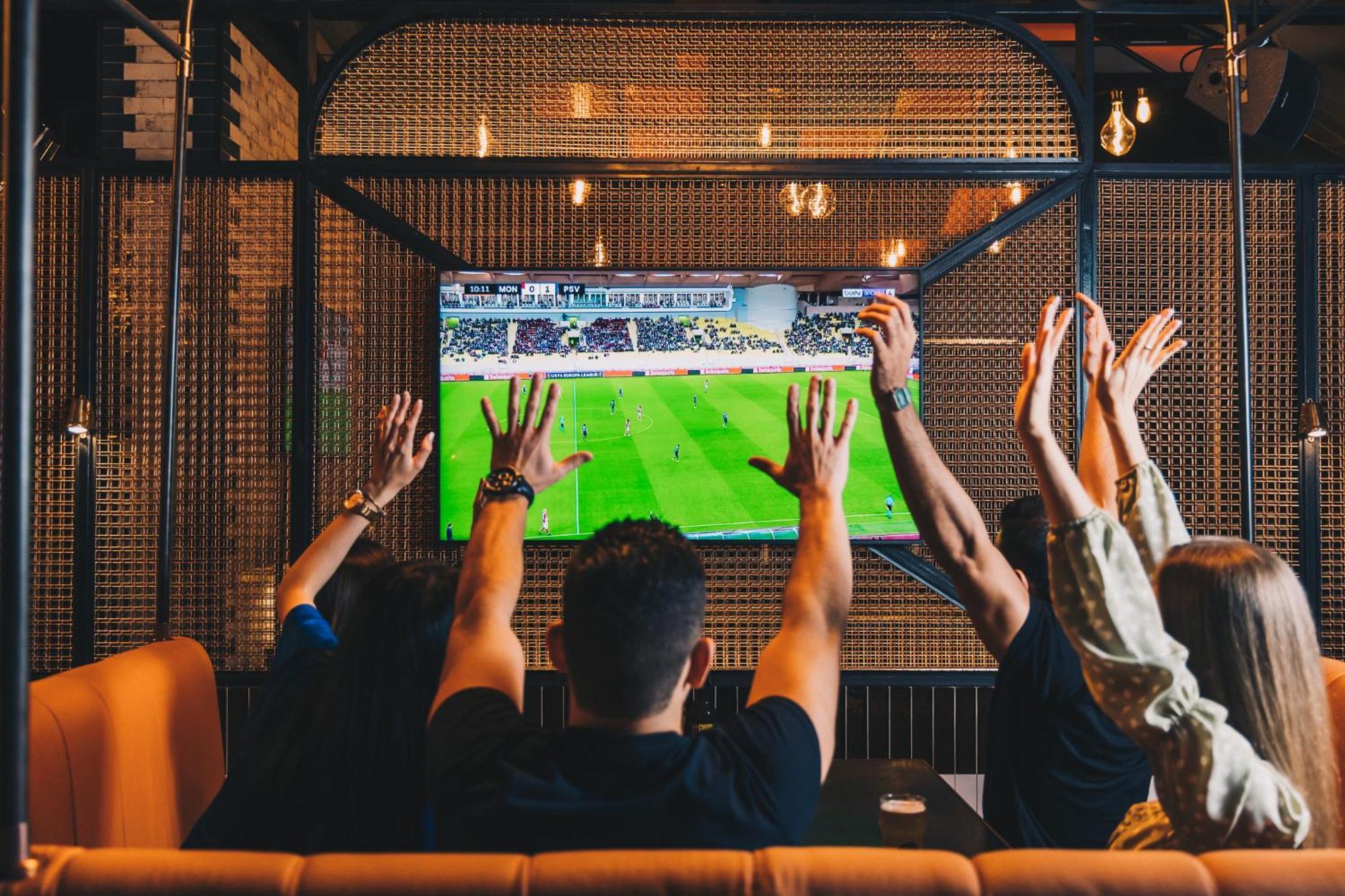 Five Jumeirah Village Дубай Экстерьер фото Watching a game on television