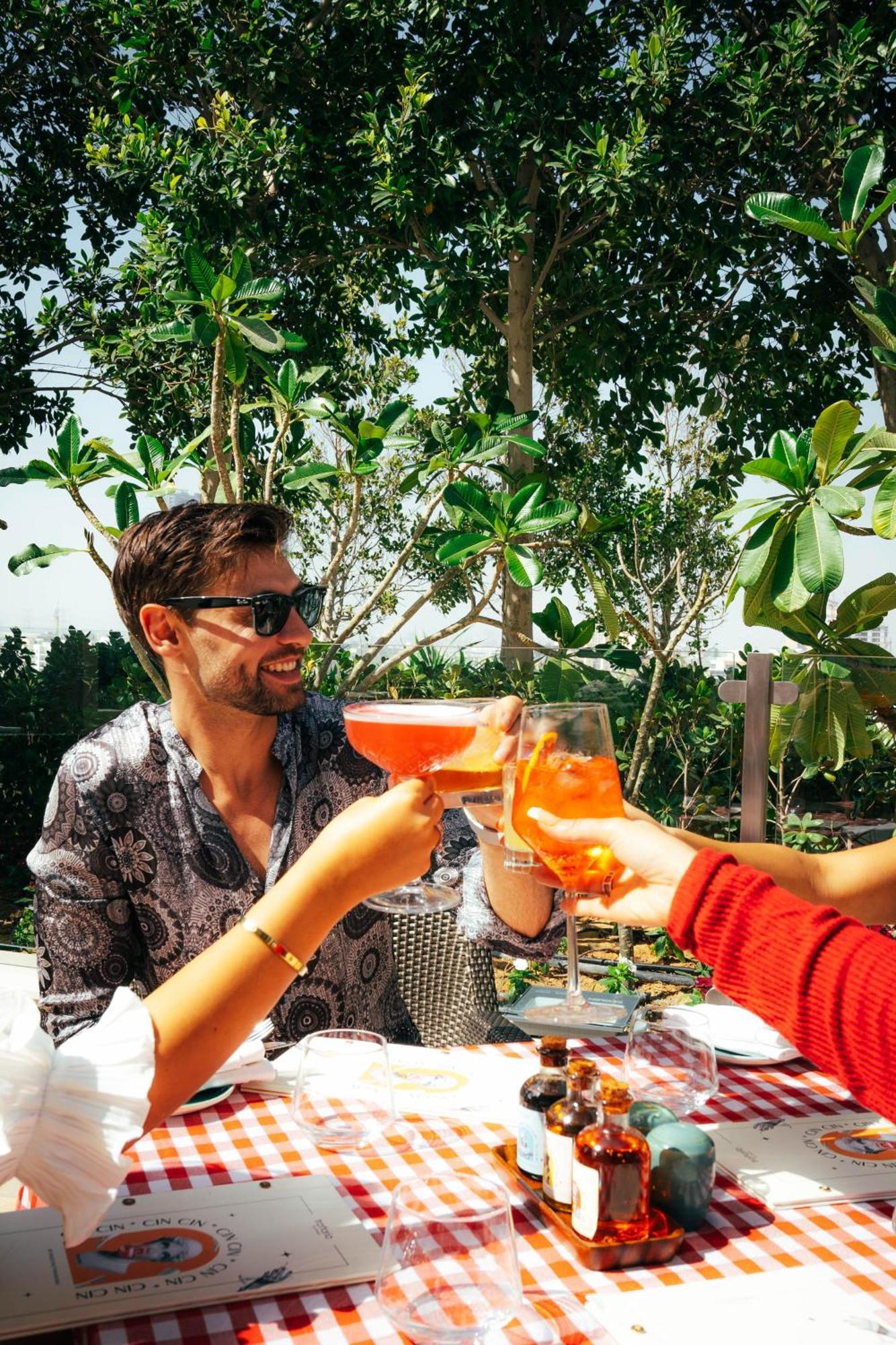 Five Jumeirah Village Дубай Экстерьер фото A man drinking a spritz